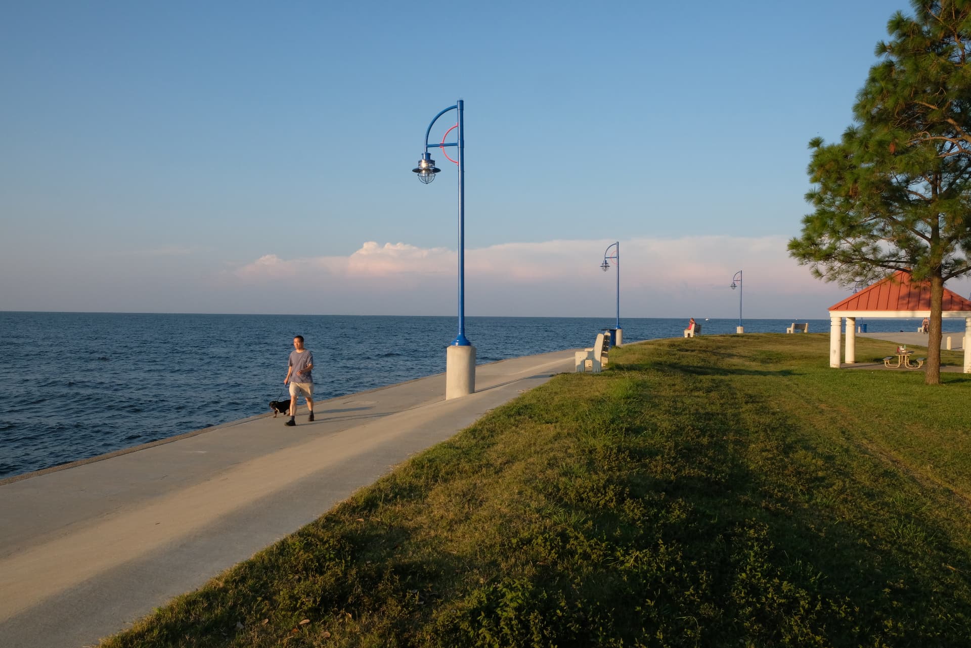 Completed lakeshore promenade with light posts and shoreline protection