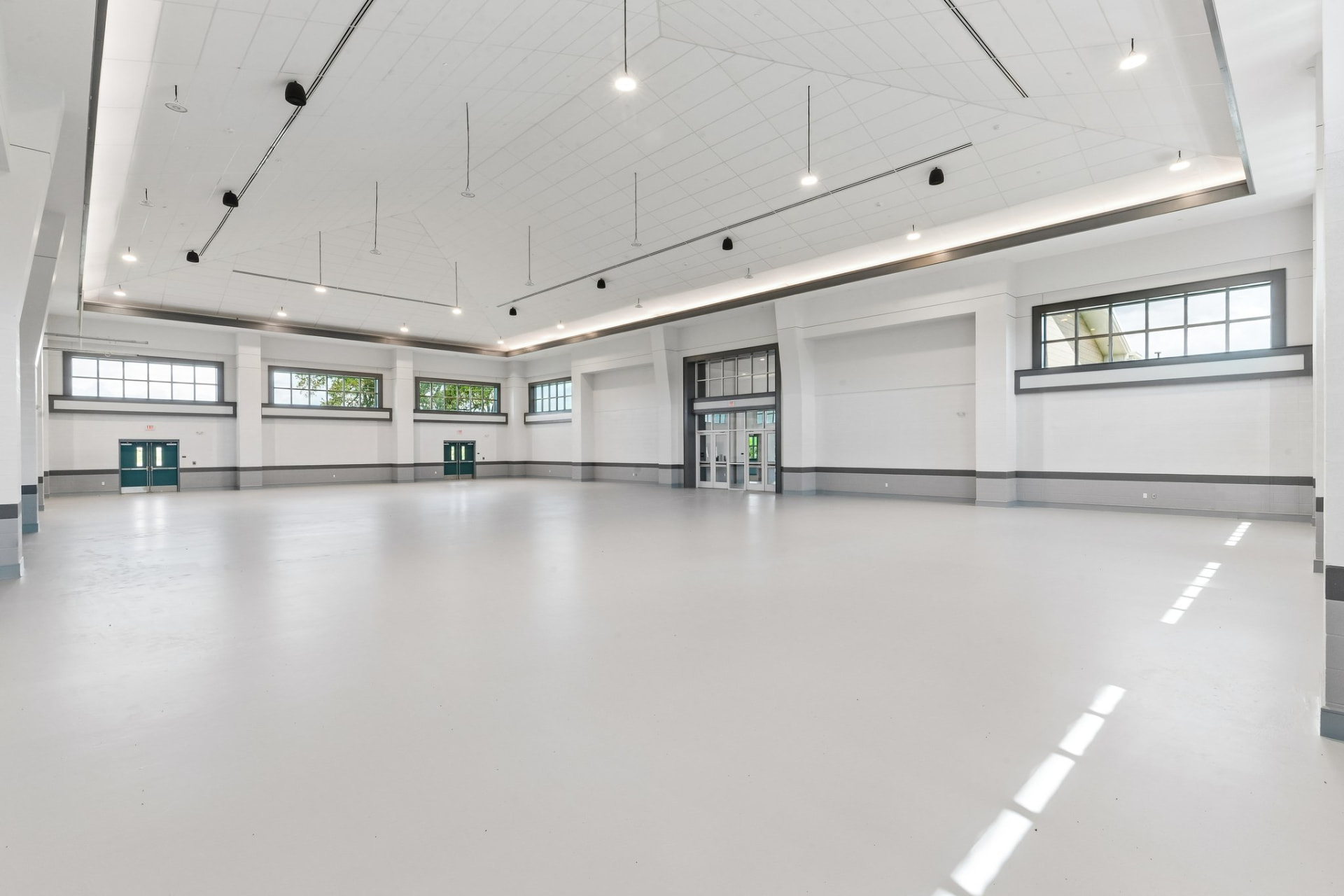 Completed community hall interior with high ceilings and clerestory windows